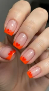 Neutral Nails with Orange Heart Tips