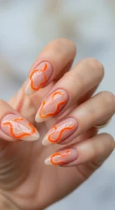 Nude Nails with Abstract Orange Tip Swirls