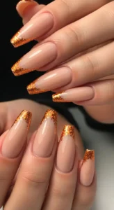 Nude Nails with Orange Glitter Outline